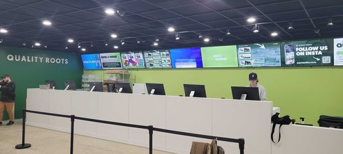 inside the Quality Roots Pontiac Dispensary interior checkout counter
